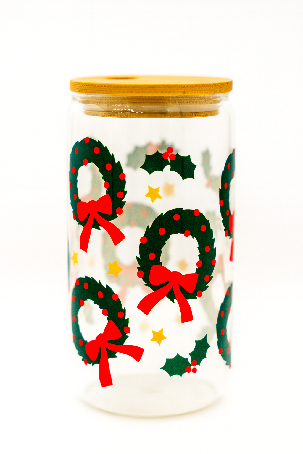 Jar with Christmas wreath and bow design on a white background